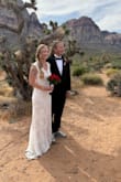 I wore this dress for my Las Vegas elopement, and it was the perfect dress for the occasion. Slightly stretchy, but also so delicate and elegant. The train length was easy to manage, and the dress was comfortable enough to wear all day and night. The ivory color worked really well with my fair skin. The dress is very long, so I had it hemmed 3" and had a bustle added (5'4 with 2.5 heels) - Samantha M.