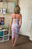 This dress is exactly what I was looking for. The fit it true to size. It's stretchy and comfortable. The straps are adjustable, which is a bonus. - Becky H.