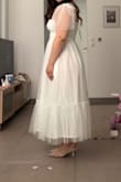 I looked for many dresses because my arms are thick, and I couldn't find any that I really liked. This one created exactly the effect I wanted it subtly and elegantly concealing my arms.

The top fits like a corset, so I don't need to wear a bra, and the way the dress falls is very beautiful and flattering. I absolutely loved it.

The only downside is that it's a bit see-through, so I had to buy a slip. Other than that, everything is perfect =M

By the way, it arrived one week earlier than expected, which I really appreciate. - Alessandra D.
