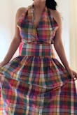 38d, 27-28 waist, I loved how unique this dress was. The info said no stretch, but since I fell between sizes, I got a small. And that wouldn't zip where my waist was. So I got a Medium, here are photos of me in the medium. I still had room in the waist; the sides of the halter are big, so I would have to pin them. The dress was loose all over, so I kept both. And decided to lose a few pounds to fit the small. - Debra B.