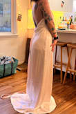If I could have chosen just the back of this dress, I would have. It was AMAZING! But the front made me feel like there was a plastic bag on my chest. The look was not flattering. I hadn't steamed it yet, but based on other reviews, the way it's pictured here is just how it is. - Elora S.