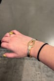 I love the style and size and it looked so good with my outfit... however, it is absolutely impossible to wear. In the span of an hour, it's fallen off 4 times.. and when I say "fallen off" I mean it's flown off my wrist. Quite embarrassing in a work meeting! The magnetic clasp that closes it (shown in photo) is horrible. So disappointed with this quality. - Sarah N.