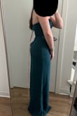 Bought this as an option for a wedding guest dress. I thought it was just ok, the overall fit was fine but the zipper stuck out a bit in the back which I think just makes it look cheap. You could also see some of the layers underneath through the front. Ended up returning. - Elise B.
