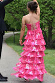 I loved this dress; the color was a true hot pink. Only concern with it was that the top rolling down a little bit wasn't too bad. Overall loved this dress. It was perfect got so many compliments. Front and back! - Lydia Y.