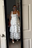 I bought this dress for my wedding. I'm 5'2, and the length of the dress is perfect even with heels on. The only downside is the straps are a little big on me, but otherwise absolutely beautiful dress. The flowers on the dress are the perfect size, too. - Maia L.