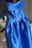 Amazing dress! Worked beautifully for a spring formal and received so many compliments. There is zero stretch, but it fit me wonderfully! The strapless top does tend to creep down so you will need to keep adjusting through the event. - Claire P.