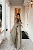 Absolutely loved this olive-green cape dress! I wore it as a wedding guest dress and received so many compliments all night long. The color was gorgeous. The fit was flattering. The cape detail made it feel so elegant and unique. It was comfortable to wear for hours and photographed beautifully. I would definitely recommend this dress for weddings or any special event! - Erica S.