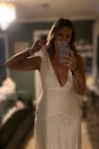 Fits great everywhere but, the chest/shoulder straps will definitely need to be altered. Material is not cheap feeling at all. The lace design is beautiful. - Bethany D.