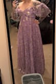 Very flowy, super cute dress. I have smaller boobs (Ccup) so I didn't need much support, but if you are bigger, you'll probably want to wear a strapless bra. It fit true to size, and I really enjoyed wearing it! - Becca D.