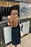 I really like this dress and have worn it on vacation as well as to work events. I'm short so it hits just below rather than above my calves. I'll also note is that it has two layers and the outer layer is quite thick so it can get a bit hot. - Nicole B.