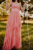 This gown!!! Purchased for a 22nd birthday photoshoot and instantly fell in love with this dress! It's flowy, has a shimmer to the ruffles, the corset is beautiful, love the color, fit and the fabric! - Windy F.