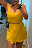 The color is more of a bright mustard yellow not so much like the color as shown but still love it. The skirt is longer than expected, but it's great. I love the fit. I'm gonna get it in all colors, it's so flattering. The top is adjustable. The bottom is slightly big but comfortable to where when I sit down it won't squish my belly out. Hehe - Jen H.