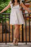 I absolutely loved this dress! I got it for my college graduation pictures and ceremony. I bought a few options but returned all the others when I tried this one on. I wouldn't say my chest is large, but I know it also isn't small. However, the tie in the back was slightly awkward about keeping everything in place so I would suggest wearing body contour tape to hold everything up. - Campbell P.