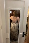 I am between a medium and a large. I ordered a size up to XL, and it fit more like a medium. Beautiful and pretty flattering. I almost returned it because I don't know when I will wear it, but I loved it so much I decided to keep it. I will say that the boob area is pretty loose and gaping. You can't tell in the photos, but I'll have to wear fabric tape to keep everything secure. - Kathleen O.