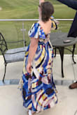 This dress was perfect for an upcoming wedding. It fit nicely around my waste and was easy to zip up. I did have to sew the sleeves to make them a little shorter because they were not tight enough but that's simply because I'm short. This dress was really nice quality, and I would recommend this dress to anyone. - Susie K.