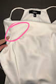 This unfortunately is quite see-through. Up near the neckline has a double lining that is overly visible through the fabric and is too high up for a slip to cover. My event is outdoors in the daylight so this unfortunately is a no-go. - Randi H.