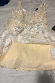 I was so excited to wear this dress for my wedding rehearsal until I opened the dress, and it was literally yellow. I understand the under layer was supposed to be more on the ivory side, but the description online is beyond wrong, and the dress is yellow. - Kaitlyn G.