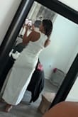 Loved everything about this dress, just returned it because I chose another one. But it fit perfectly. Looks expensive in person and is a great material - doesn't feel thin or cheap. I'm pretty dark/tan right now and wasn't see through at all. - Aspen