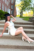This dress was perfection for my daughter's college graduation photo shoot! The material was thicker and very good quality, plus there was the added benefit of a full liner. We realized that the back ties were much better in a simple knot vs a bow. The bow would loosen up repeatedly, and ended up looking messy compared to keeping the ties in the simple knot. The knot also helped to keep the sheer side panels perfectly taut and in place without having to tighten and re-tie them every few minutes.
My daughter is broad-shouldered and athletic build, so the dress did run on the shorter side on her frame. Her shoes were also from Lulus (ivory satin pump sandals). - Cori M.