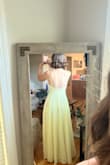 This dress is pretty, but I ended up going a different direction. I'm pretty consistently a size medium, and this dress felt too big, so I would definitely size down. - Violet W.