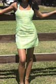 I really adored this dress. Very simple and cute. I sized down and got an XS even though I usually get smalls and I'm grateful I did. I wanted the dress to be as close to a snug fit as possible while still being appropriate. I wore this dress to a derby themed event, and it received many compliments. As other reviews have mentioned the dress was a little loose in the strap area. For me, it wasn't horrible. Barely noticeable. However, if I leaned or bent a certain way occasionally the strap would slide down. I just made sure my posture was straighter than average, so it wasn't relevant throughout my night. The material felt great, not cheap. Be careful because it is satin and can snag on your jewelry. Overall, I am happy with this purchase. - Jade S.