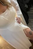 I wore this dress for my courthouse wedding, and it was perfect. If I had listened to the size guide, it might have fit a little better in the chest area. I got a lace bandeau bra, and that did the trick. Great quality material and got lots of compliments. - Mahleah G.