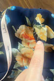 Dress was delivered with a rip on the side near rib area. - Meg H.
