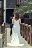 I was happy with the dress, but I had it altered a bit. I didn't like the line at the waist, so I had lace added there and also on the sleeves. - Jeanet D.