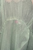 Dress looked beautiful and fit beautifully, but when I put it on to walk out the door, I saw these little pink circles all over the fabric. I wish I would have seen these before cutting the return ribbon off. Plastic bag was totally in tact when receiving the dress so I didn't look that closely when trying on. Check the dress before wearing! This dress is too pricey to have these flaws, super disappointing. - Mc C.