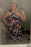 I am normally a large and needed an extra large for this dress. 
But it was the perfect dress for a wedding and reception. It was flattering, and I didn't have to worry about keeping my chest covered up or gut sucked in. It was perfect for dancing and moving all night long! - Laura F.