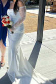 I was completely in love with this dress!! My wedding was small, so I didn't want a regular wedding dress but I still wanted something that would clearly yell "I'm the bride", and this was it! The sleeves ran a little big on me but they weren't falling off my shoulders or anything like that. The material felt so comfortable on my skin, it wasn't itchy and didn't feel cheap. I usually wear a medium but based on my measurements (which I took before buying the dress) I was recommended a large. It fit like a glove! Overall, for the price, I couldn't have asked for a better dress. It was classy, comfortable, and a very good purchase. - Maria G.