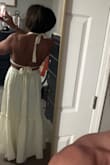 Fit well in a small despite what other reviewers stated. I usually need a medium in Lulus & a small was fine. Skirt is just too much and too poofy for my taste. - Nancy W.