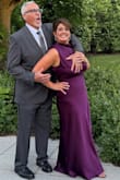 I absolutely loved this dress! I wore this to my best friend's Navy Retirement Ceremony, but it had a wedding vibe. 

The purple satin color was perfect, rich, elegant, and exactly what I wanted. The asymmetrical cut gave it a slightly edgy feel while still being classy and subtly sexy.

It is very long; I'm 5'3" and needed 4" heels, but it made the dress feel extra glamorous. The fit was flattering and the fabric draped beautifully.

The only minor issue was that the covered buttons in the back were a bit tricky to fasten. Otherwise, it was stunning, and I received so many compliments! - Christina P.
