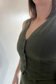 This material is gorgeous and I love the matching trousers - makes for such a great outfit. However, I had to return the medium I ordered - the fit was great everywhere except over the bust. It gave me quad boob and I was worried the buttons wouldn't be able to hang on. I got a large and could have even gone XL and they both would have fit. It does shrink a little in the wash (I know it's hand wash but that's just not always realistic for me so I wash on cold gentle cycle with no spin and steam it after it's dried). If you're large busted or are unsure of sizing, go up! - Emily P.