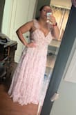 This was a beautiful dress. It true to size. I ordered a large and I'm a bit busty on top. It's comfortable too. - Ashley A.
