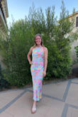 I love the fabric and pattern. Form fitted enough to show curves but not too tight. Silky fabric but second layer to prevent it from showing lines. Super cute with the halter detail and perfect length! Wore it for a nice dinner out. - Erica W.