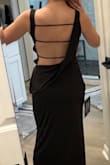 Comfortable, stretchy fit. The back is unique and sexy. I like the mix of conservative (neckline) and sexy (slit and open back). - Maggie S.