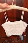 This is a super cute 2-piece; however, the top is designed in such a way that it actually flattens the bust area, rather than supporting the bust area. It gives the bust a flattening appearance versus a lifting appearance. I am a 34B, and my bust is fairly perky, and this top flattens my bust area. That being said, I still think it's a beautiful, well-made two piece set and I'm gonna keep it. - Melissa B.