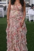 Everyone LOVED the dress. It does run big, in my opinion, and I did have it taken in. I would size down one size. The colors are beautiful, the design I beautiful. Just love it. - Selina S.