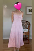 The dress is so soft and flows amazingly. It hugs my body - the top part is snug though. Not so tight that I can't sit or breathe, just enough that it is tight so it looks like it's snatched. My under bust is about 30" and 25" waist. The back is stretchy, so I'm sure it can give or take a few inches. I got 2 colors to try and decided to keep both. - Feipu S.