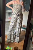 Absolutely love this jumpsuit and would recommend it 1000%. I'm 7 months pregnant, but I wanted this and figured it would fit after I have the baby. I ordered size small (my usual), and it still fits over the bump comfortably, so I don't have to wait to wear it. And it has pockets! - Holly Q.