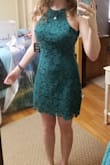 Love this dress! I bought it in magenta and green and wasn't planning on keeping both but I loved both of them so much! The magenta is a gorgeous color and the green is perfect! It appears a bit teal in my picture because of the lighting, but it is a beautiful green! The style is so flattering for larger busts and is the perfect length (not too short, not too long). It can easily be dressed up with a blazer, jewelry, and heels for more formal or business occasions, but it's perfect for a spring event such as graduation! - Caroline J.
