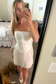 I bought this dress to wear to my bridal shower. I tried it on right when it arrived and it fit great and I was so excited to wear it when the shower came around. It sat in my closet until the event, I did not put it on after the initial try on. The morning of my shower, the zipper to the dress was extremely difficult to zip and when I finally got it zipped, the entire zipper busted and there was no fixing it. Obviously I freaked out and luckily had a friend who's wedding was this year and had an extra white dress. Needless to say, this material is extremely cheap and I would not recommend purchasing this dress if you want it to hold up for an important event! Will not be doing my dress shopping at lulus after this incident. - Cecilia V.