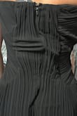 This dress was everything I was looking for, but when it arrived, I was extremely disappointed. The dress I received, has a large rip on the inside of the back. Given the way it fits, I am assuming the person who tried it on prior to me purchasing it, had an issue zipping it. I am tall and slender and when I zip the dress, the material bunches in the back and the zipper is not straight. The pleats on the front don't match. The dress is on the longer side. With 3" heels, it will be okay, but even with heels, it's still on the long side (even for a tall girl). The dress bunches under the bust. - Tina D.