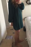 This dress definitely runs large so order a smaller size (or two). The color is a little darker, think more jungle green. Also, the sleeves are very long, so it creates a bunched up look even though I ordered a size down. - Soo K.
