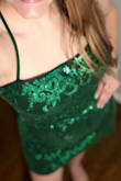 I wore this to the finals of the Miss Oklahoma pageant (my daughter was a Star). I got a lot of compliments on the dress. The pattern and the sparkles were beautiful. The color is a rich emerald green. It's definitely short, but I didn't feel like it was too short. I do wish the loops on the back were stronger. I struggled to tighten the dress myself because I worried they'd rip. When I had someone help me, they, too, thought the loops might rip. So we had to be extra delicate when tightening the straps. BUT I did love that the straps were adjustable with the back "corset" tying. It made the dress feel more adjustable and secure. - Meredith W.