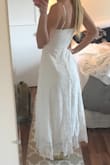 Beautiful dress! It fit perfectly. The material was heavier than I expected it to be, but it's not too warm or stuffy. Definitely a perfect summer dress. - Emma V.
