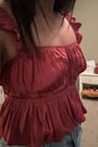 I really wanted to like this, it's sooo cute and I purchased it as soon as it came back in stock. I am pretty flat chested so a top like this isn't the best where there's an area that's meant to be filled out. But boy was it unflattering in the boob area. The pleats came uncreased and billowed out at the boobs making the area look very unflattering.  Even with a bra on to help fill out the area.  I really loved this style though, and I hope it works out for others! - Audris L.