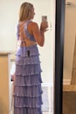 This dress is so feminine and fun! The material is heavy!! Feels much more expensive than it was. I loved the swishy movement of the tiers. The back was not my favorite style - a little bit like a backpack, it's too much going on. The length was perfect. Overall I felt great in it! - Kristen C.