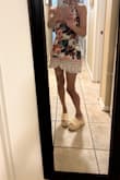 I love this outfit and it gets compliments. If you are torn between sizes go a size up. It is short, but not inappropriately so. I wear it tied behind the neck and feel great in it. - Sharan R.